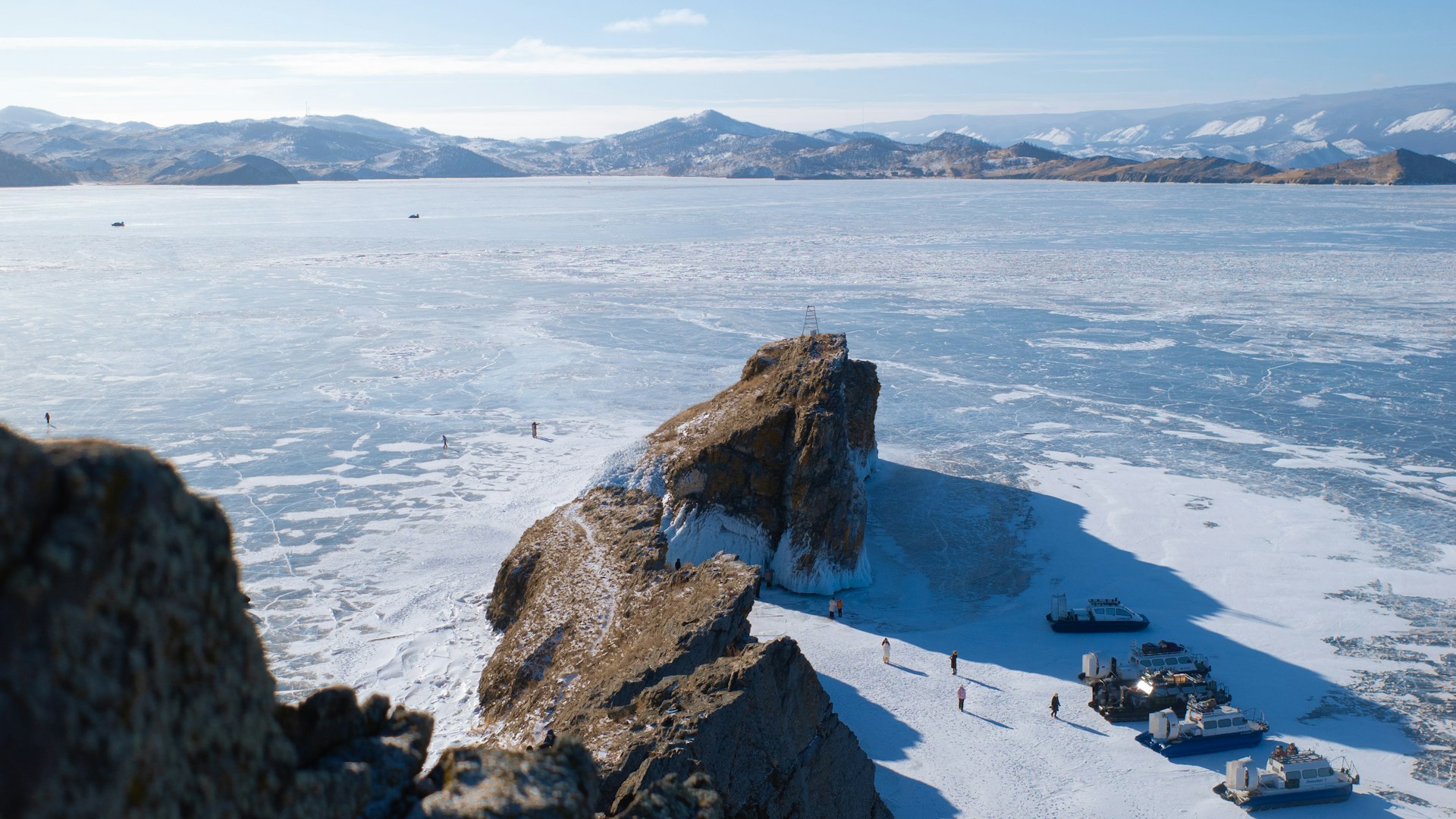 Lake Baikal, Siberia — frozen turquoise waters and rocky cliffs